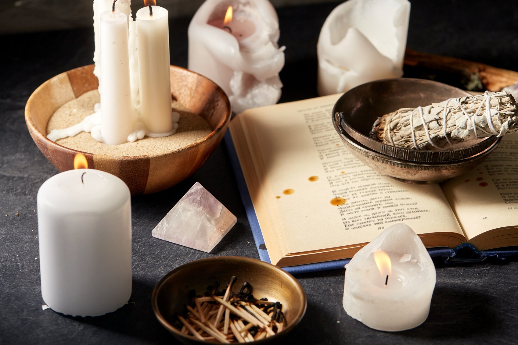 Magic Book, Sage, Burning Candles and Ritual Staff